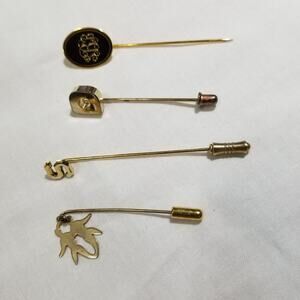 Four vintage stick pins